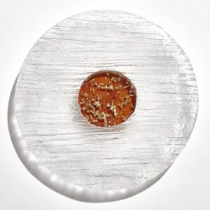 Clear glass platter with central orange and gold base