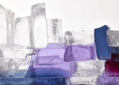 Glass sculpture with purple and blue hues, close-up.