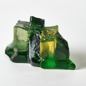 Glass art sculpture with green and yellow hues, showcasing Deborah Timperley's unique glasswork craf.