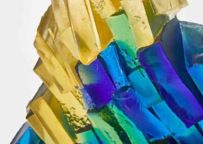 Vibrant glass art sculpture featuring colourful geometric shapes and intricate design.