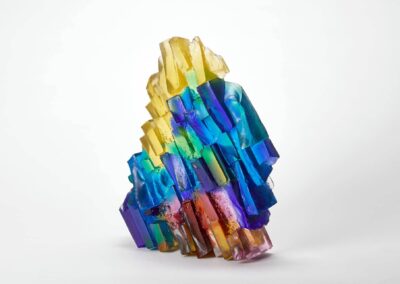 Vibrant rainbow glass sculpture with multicoloured prismatic formations.