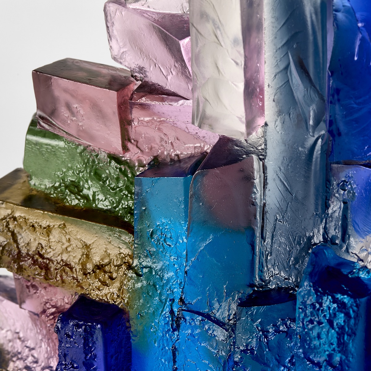 Alpine waterfall edged with Pink Heather glass sculpture by Deborah Timperley.