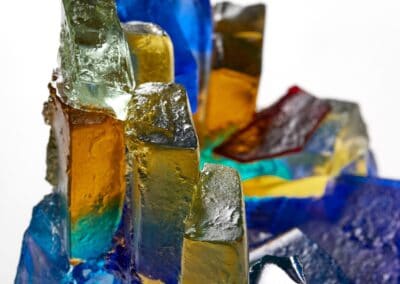 Colourful glass art sculpture with vivid hues and intricate design.