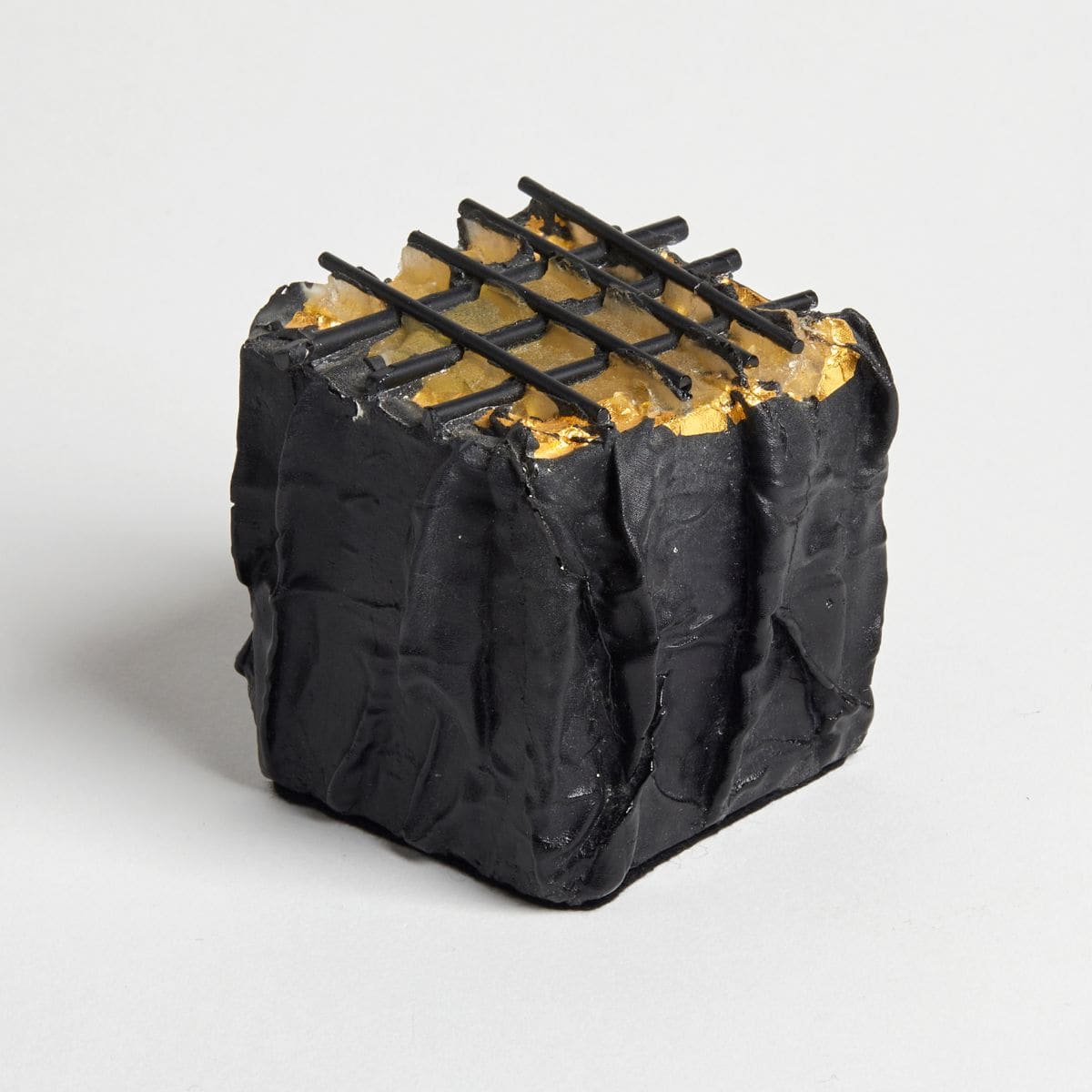 Gold leaf on a glass sculpture project, highlighting luxury and artistic detail.