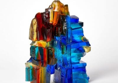 Colorful glass art sculpture with vibrant hues and abstract design.