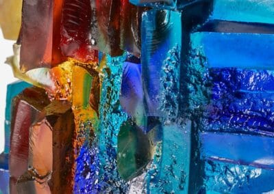 Colourful glass sculpture with vivid reds, blues, and greens.
